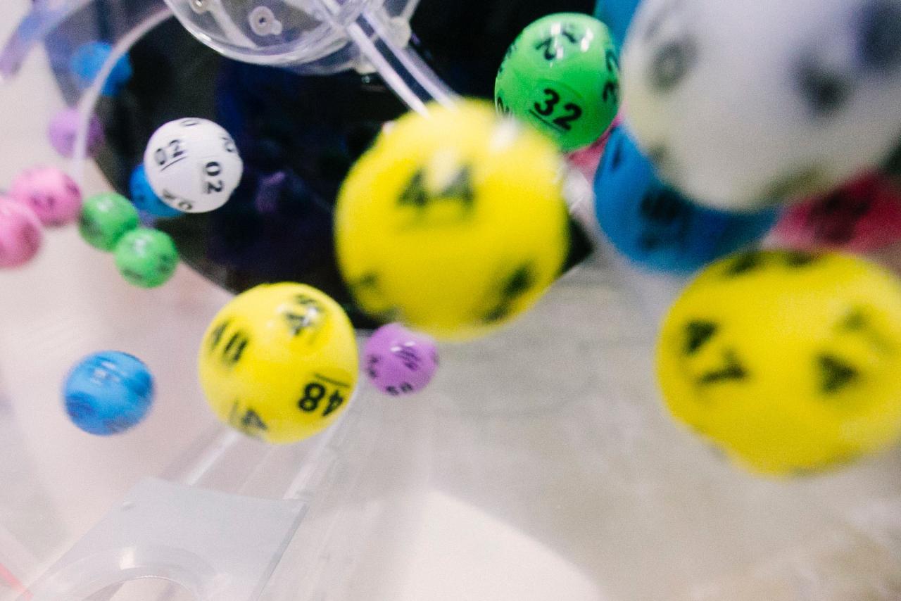 An image of colorful lottery balls falling in mid-air