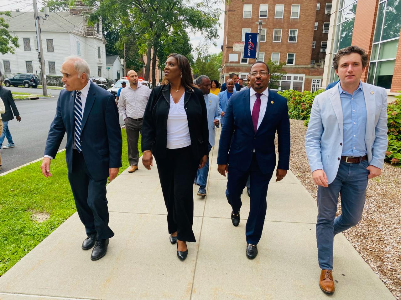 Tish James walks the streets with other important figures