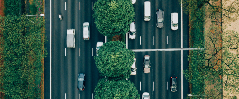 aerial view of a 4 lane highway with cars going in both directions