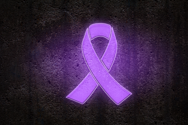 Purple awareness ribbon on dark background