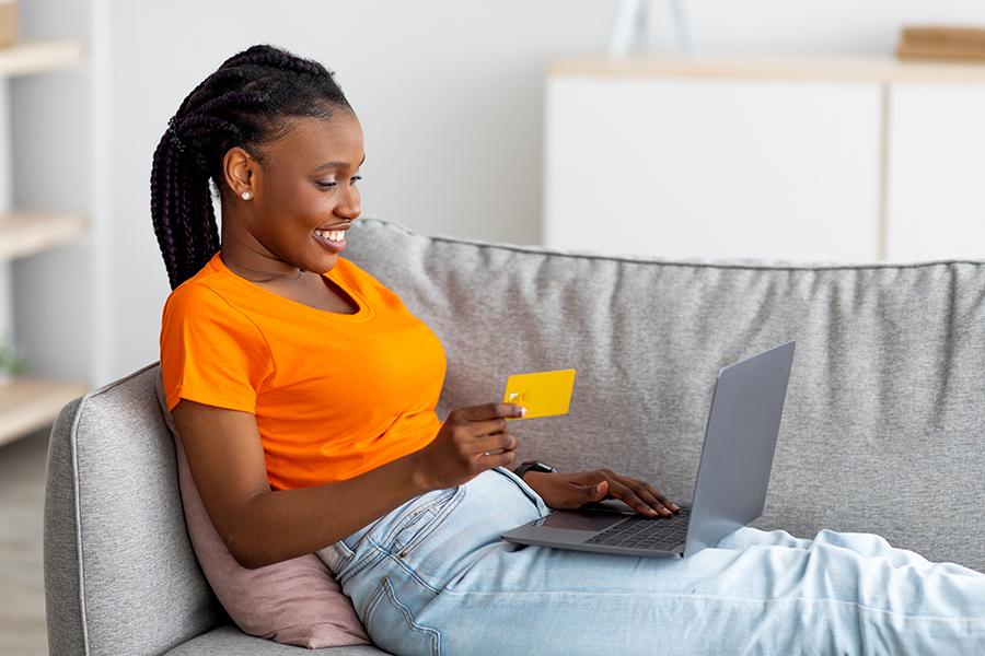 Black woman donating to charity online