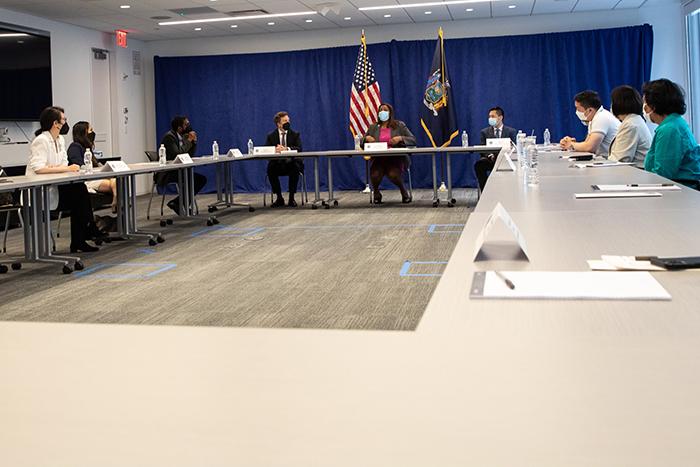 AAPI Group at table with AG James