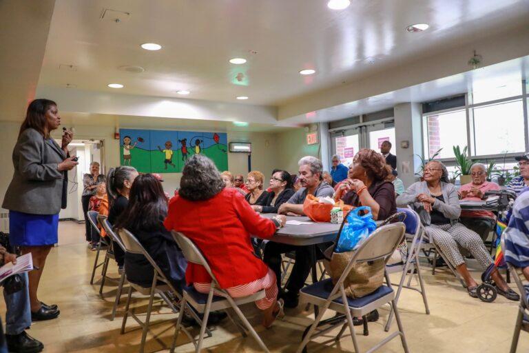 AG James speaking with seniors