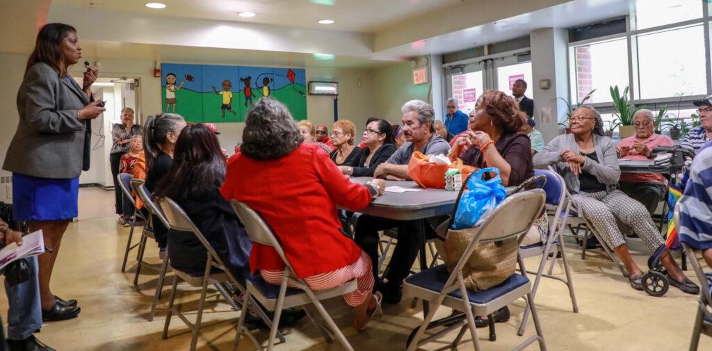 AG James speaking with seniors