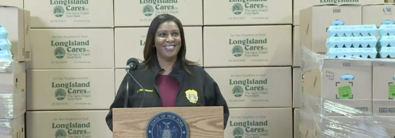 AG James in front of podium