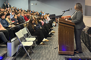 AG James speaking to a group of high school students