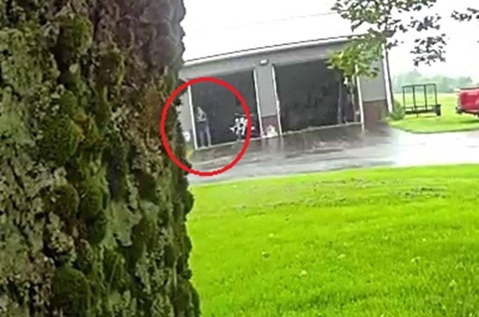 Still from deputy's BWC shows Mr. Bemis with a gun pointed towards deputies.