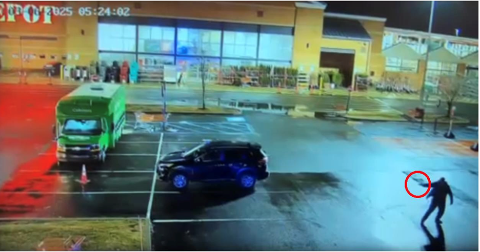 Security video still showing Mr. Johnson holding a firearm in his hand, circled in red. 