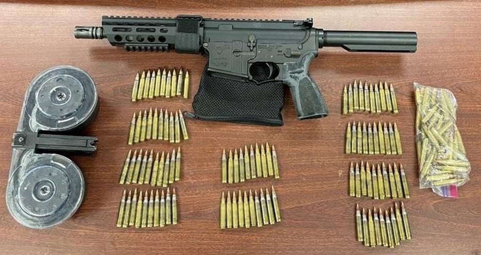 Assault rifles, ghost guns, ammunition, and a high-capacity magazine recovered by the investigation