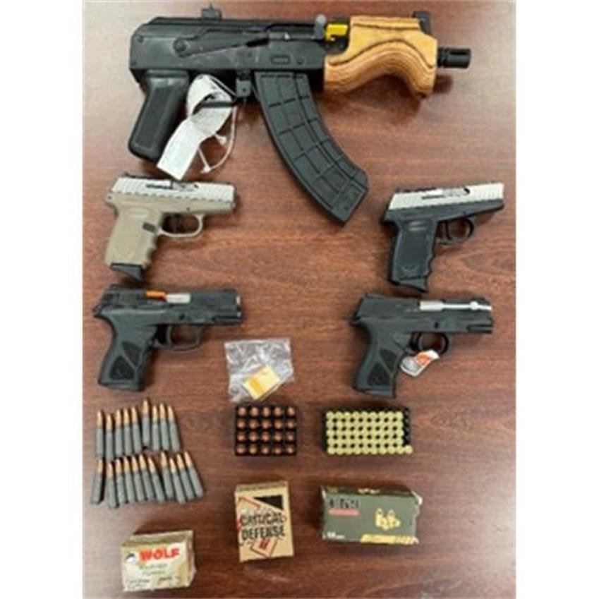 An assault-style pistol, other firearms, and ammunition recovered by the investigation